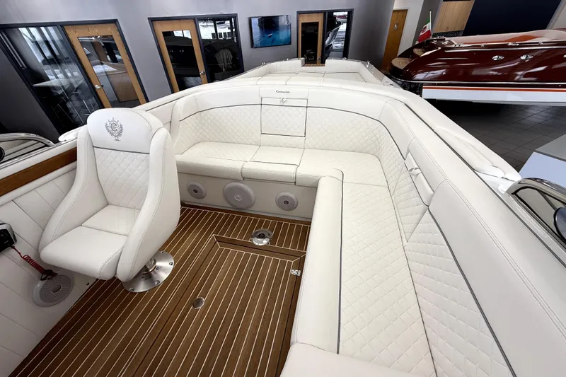 Slide: The Image of Luxurious interior of 2024 Comitti Venezia V28 with white leather seating and wood flooring. - 8