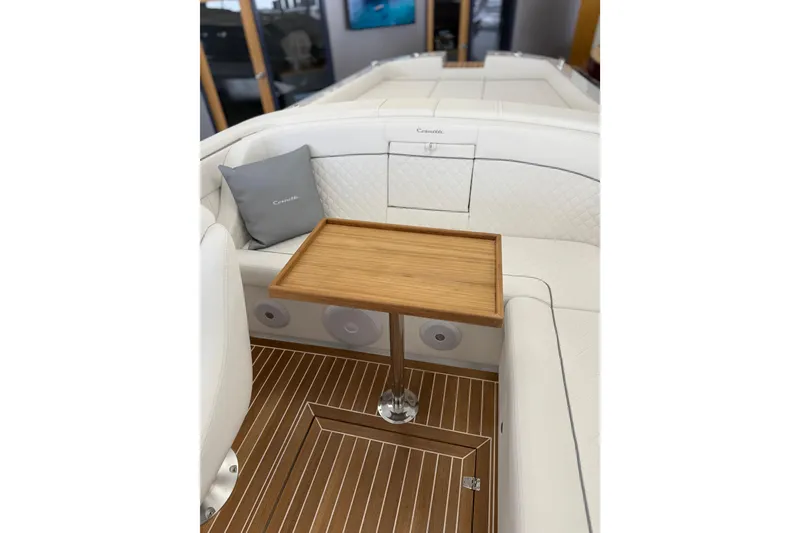 Slide: The Image of Luxurious interior of 2024 Comitti Venezia V28 boat with elegant wood table and white seating. - 9