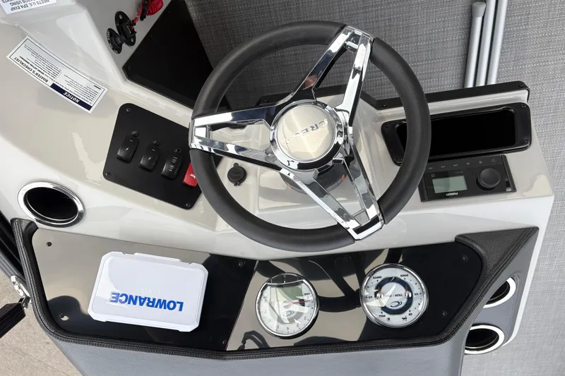 Slide: The Image of Steering console of 2026 Crest 200SE boat with gauges and controls. - 4