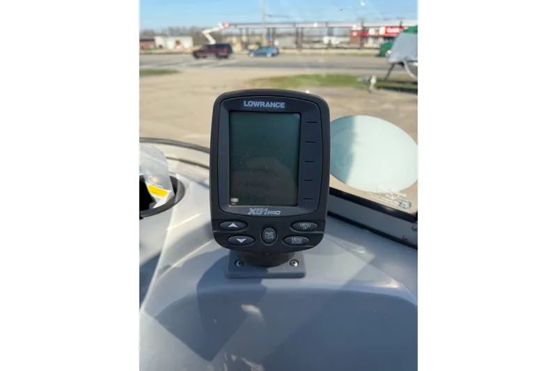 Slide: The Image of Lowrance X51 Pro fishfinder on 2010 Tracker Pro Guide V-16 WT boat dashboard. - 11