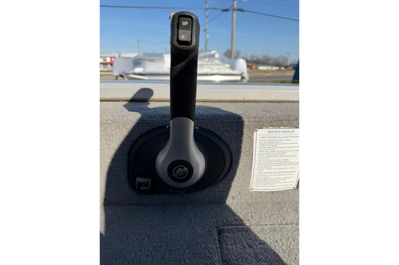 Slide: The Image of Throttle control lever on a 2010 Tracker Pro Guide V-16 WT boat. - 16