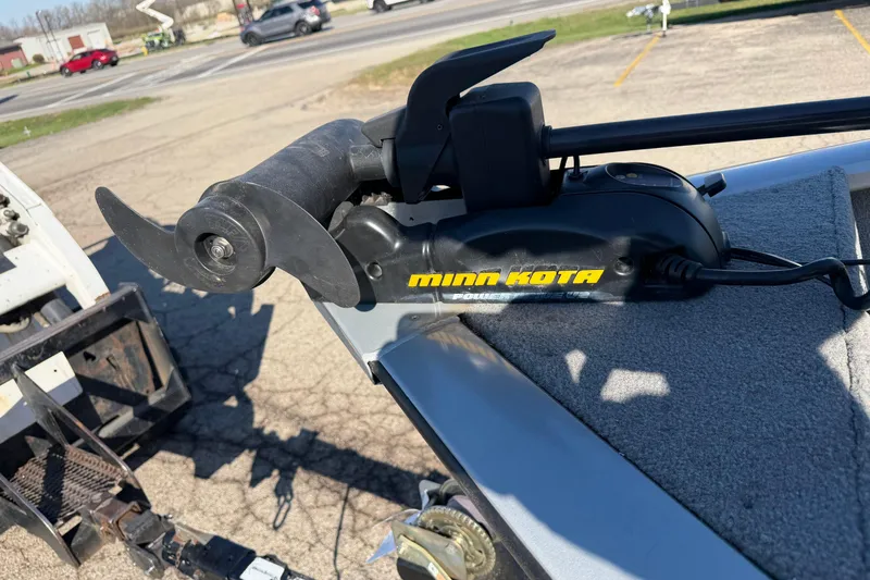 Slide: The Image of Minn Kota trolling motor on 2010 Tracker Pro Guide V-16 WT boat, parked outdoors. - 18