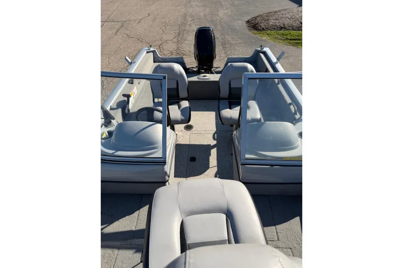 Slide: The Image of 2010 Tracker Pro Guide V-16 WT boat interior with seating and windshield. - 5