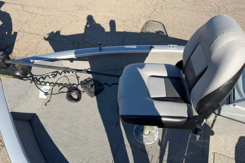 Slide: The Image of 2010 Tracker Pro Guide V-16 WT boat with a swivel seat and trolling motor. - 6