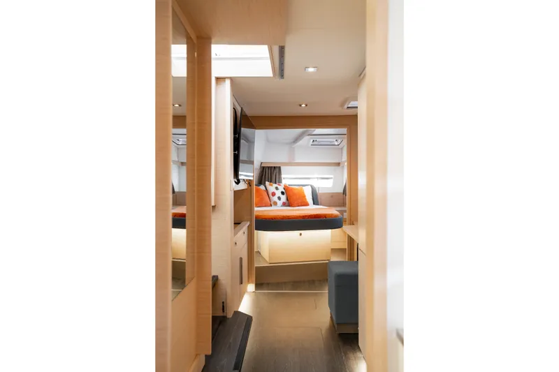Slide: The Image of Luxurious interior of 2025 Fountaine Pajot FP41 Catamaran with modern furnishings and cozy bedding. - 32