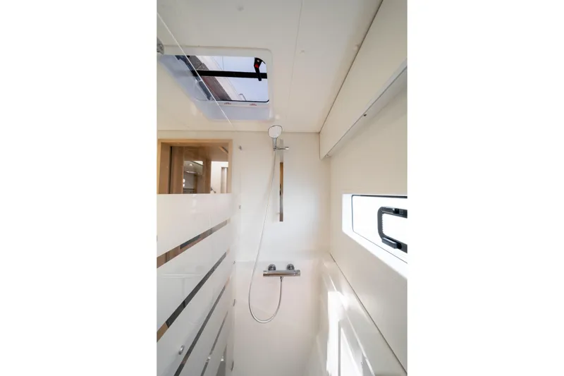 Slide: The Image of Modern shower area in 2025 Fountaine Pajot FP41 Catamaran with skylight and sleek design. - 37