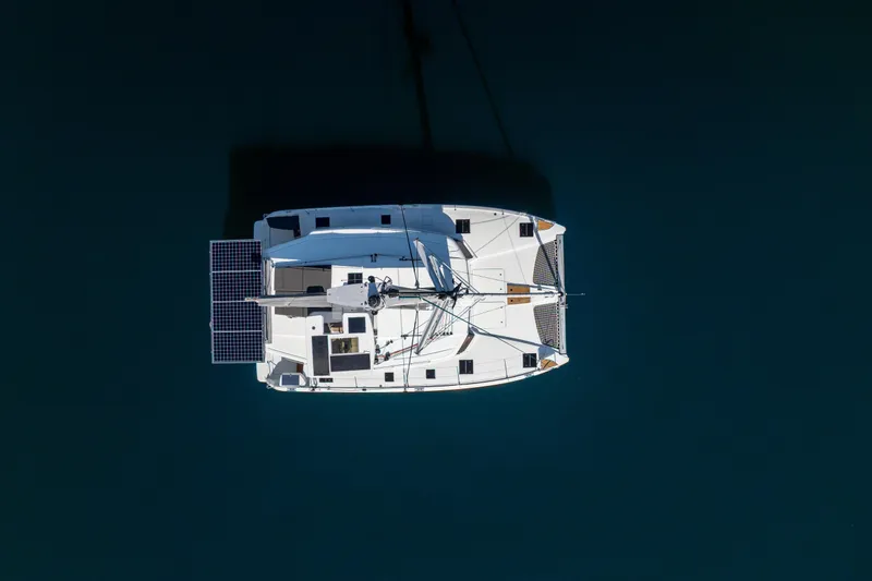 Slide: The Image of Overhead view of 2025 Fountaine Pajot FP41 Catamaran on calm water. - 4