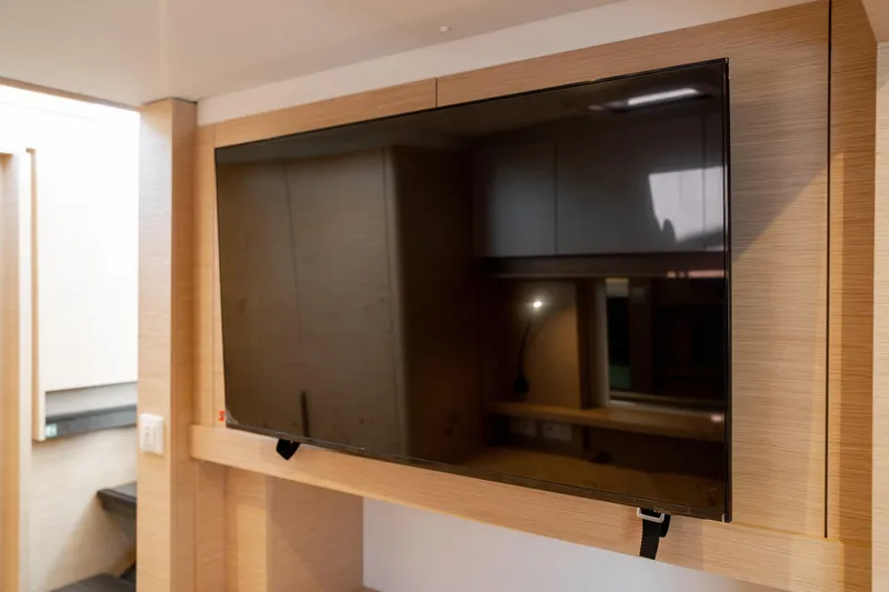 Slide: The Image of Modern interior of 2025 Fountaine Pajot FP41 Catamaran with mounted flat-screen TV. - 46
