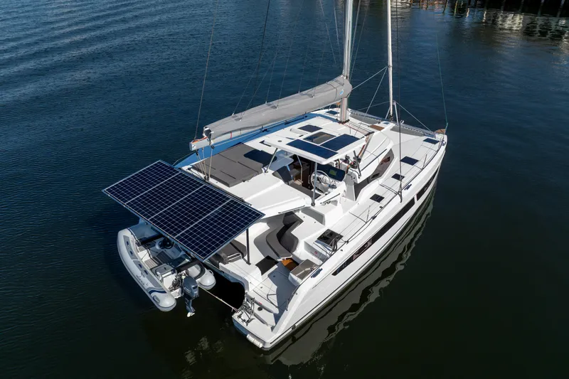 Slide: The Image of 2025 Fountaine Pajot FP41 Catamaran with solar panels, sailing on calm waters. - 5