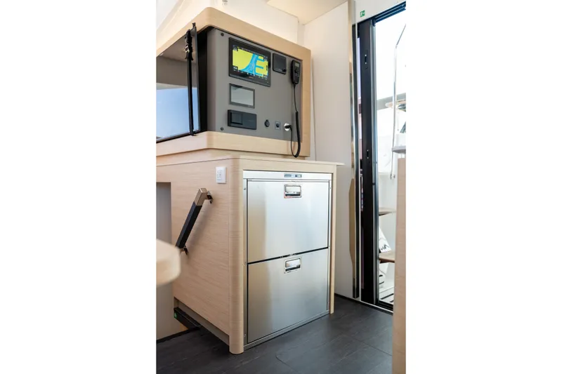 Slide: The Image of Interior of 2025 Fountaine Pajot FP41 Catamaran with navigation equipment and storage. - 50