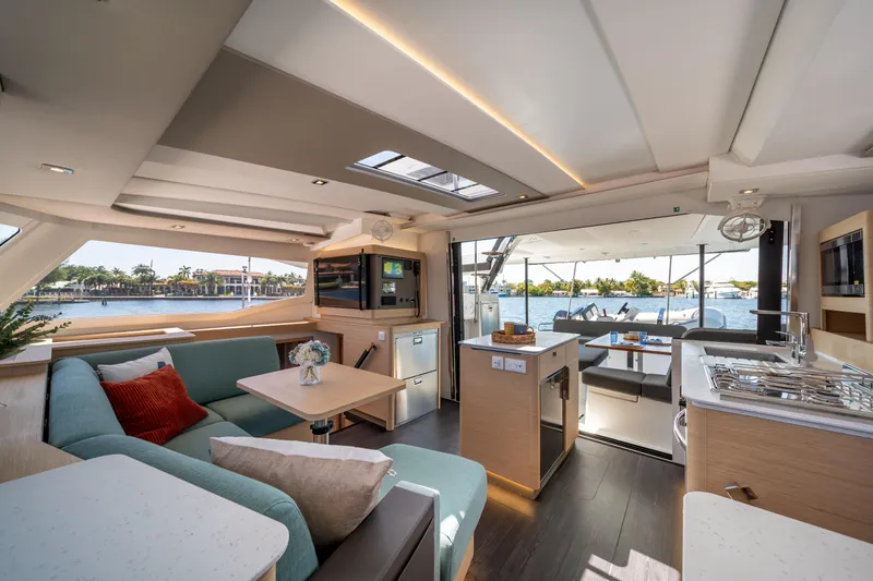 Slide: The Image of Luxurious interior of 2025 Fountaine Pajot New 41 catamaran with modern kitchen and seating area. - 53