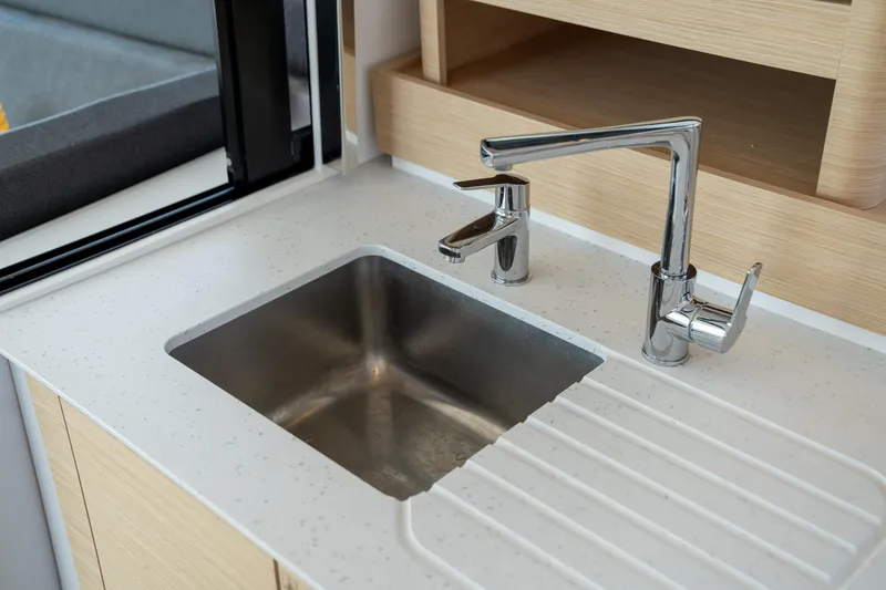 Slide: The Image of Modern kitchen sink and faucet on 2025 Fountaine Pajot FP41 Catamaran. - 56