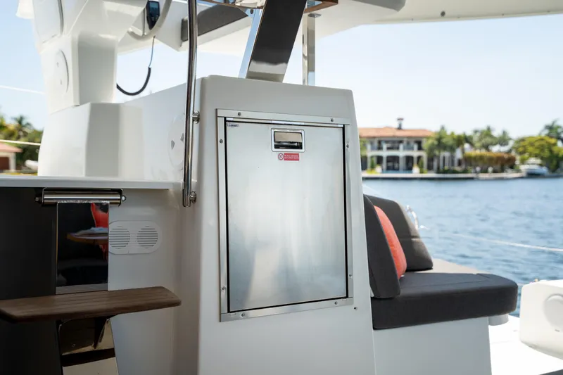 Slide: The Image of 2025 Fountaine Pajot FP41 Catamaran interior with seating and water view. - 58