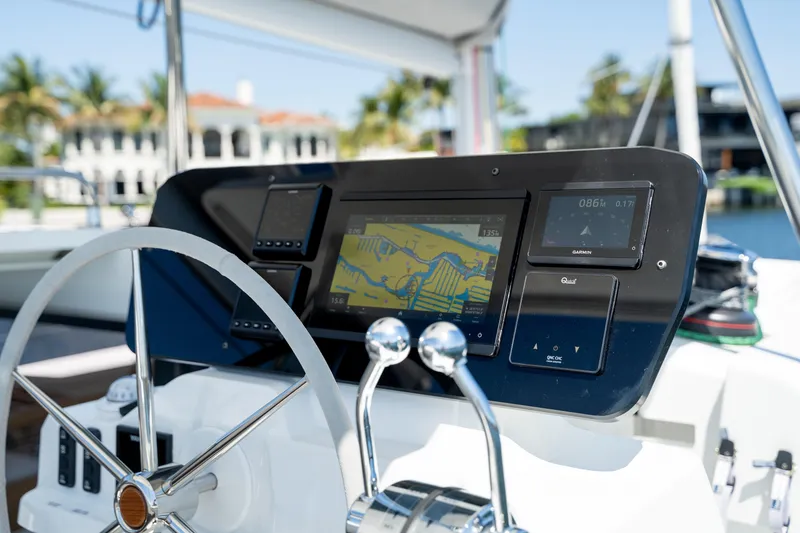 Slide: The Image of Helm of 2025 Fountaine Pajot FP41 Catamaran with navigation display and controls. - 66
