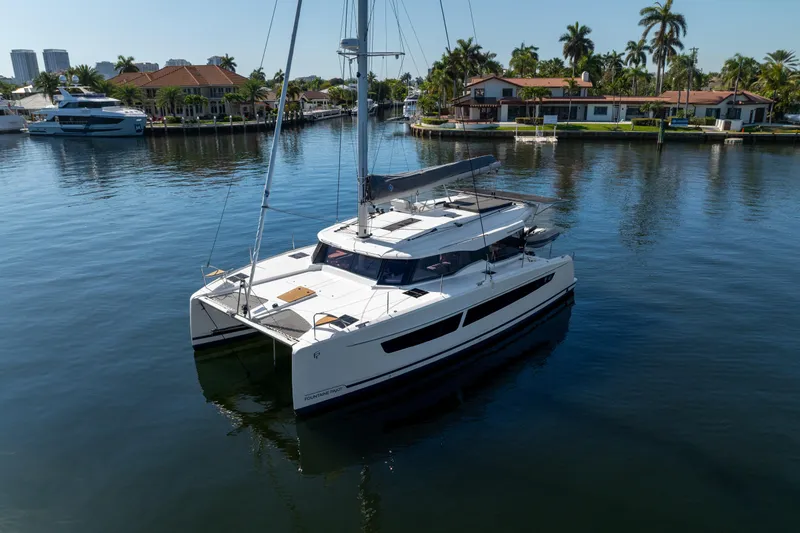 Slide: The Image of 2025 Fountaine Pajot FP41 Catamaran docked in a serene marina setting. - 7