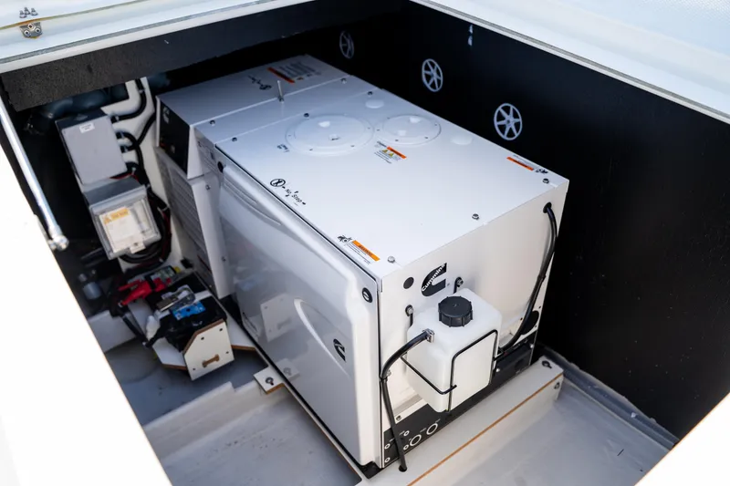 Slide: The Image of Engine compartment of 2025 Fountaine Pajot New 41 catamaran, showcasing generator and wiring. - 81