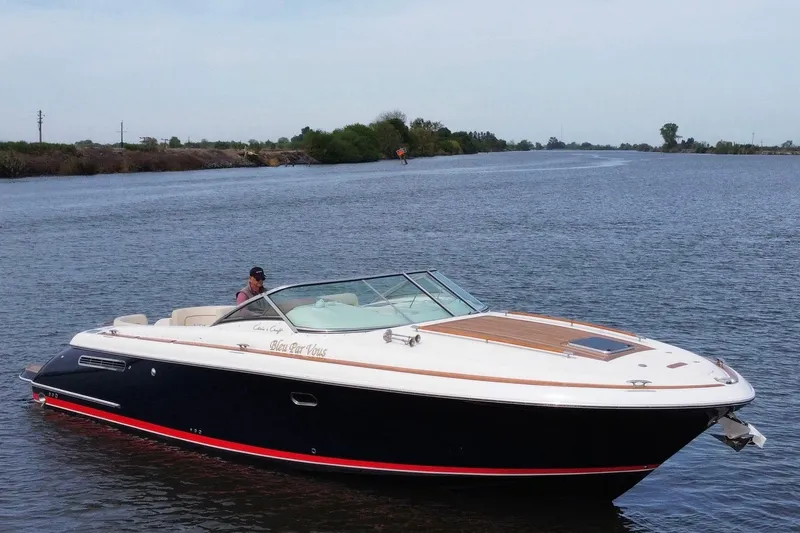 The Image of 2008 Chris-Craft Corsair 36 Heritage Edition cruising on a calm river. - 1