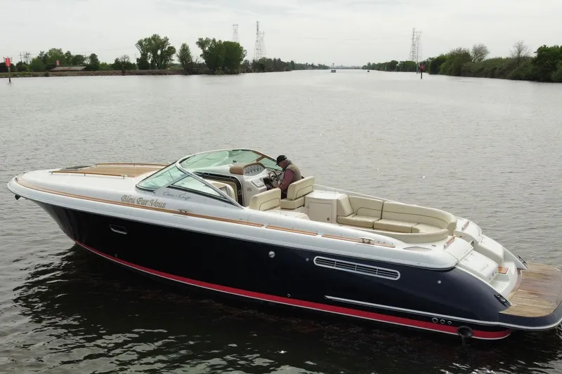 Slide: The Image of 2008 Chris-Craft Corsair 36 Heritage Edition cruising on a calm river. - 4