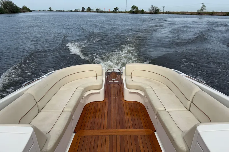 Slide: The Image of 2008 Chris-Craft Corsair 36 Heritage Edition boat with elegant seating and wooden deck. - 5