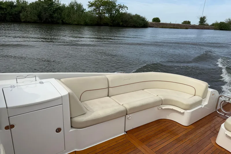 Slide: The Image of 2008 Chris-Craft Corsair 36 Heritage Edition boat with elegant seating and wooden deck. - 7
