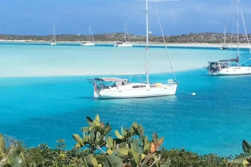 The Image of 2008 Beneteau 43 sailboat anchored in turquoise waters. - 0