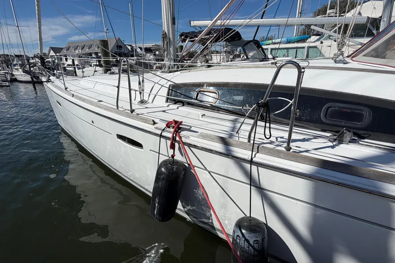 The Image of 2008 Beneteau 43 sailboat docked in marina, showcasing sleek design and nautical features. - 1