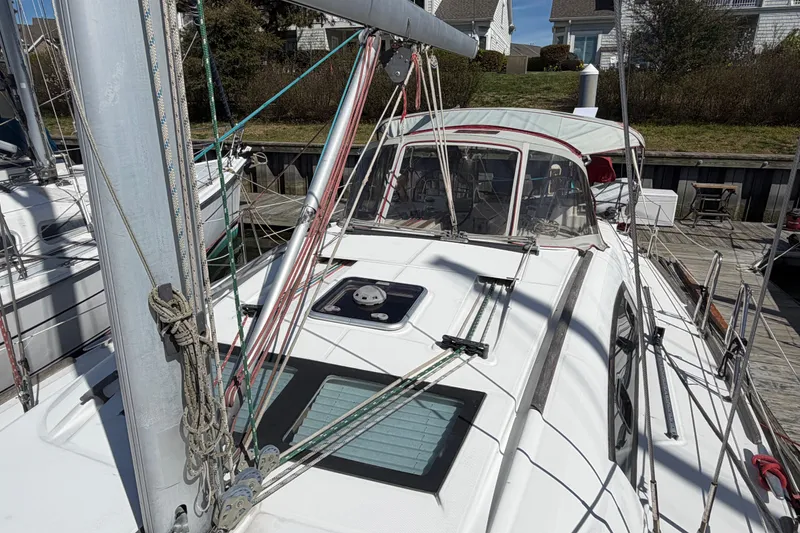 Slide: The Image of 2008 Beneteau 43 sailboat docked, showcasing deck and rigging details. - 12
