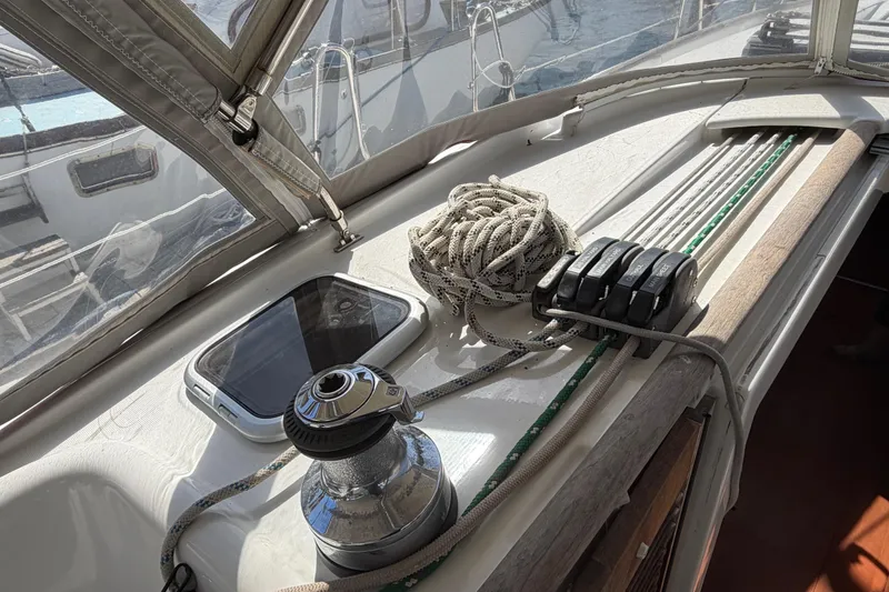 Slide: The Image of Deck of 2008 Beneteau 43 sailboat with winch, ropes, and hatch. - 19