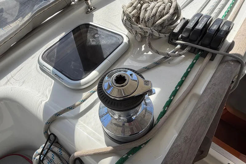 Slide: The Image of Deck of 2008 Beneteau 43 sailboat with winch, ropes, and hatch. - 22