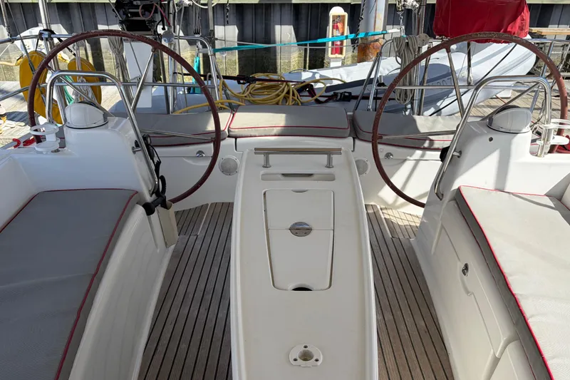 Slide: The Image of Cockpit of a 2008 Beneteau 43 sailboat with dual steering wheels and seating. - 23