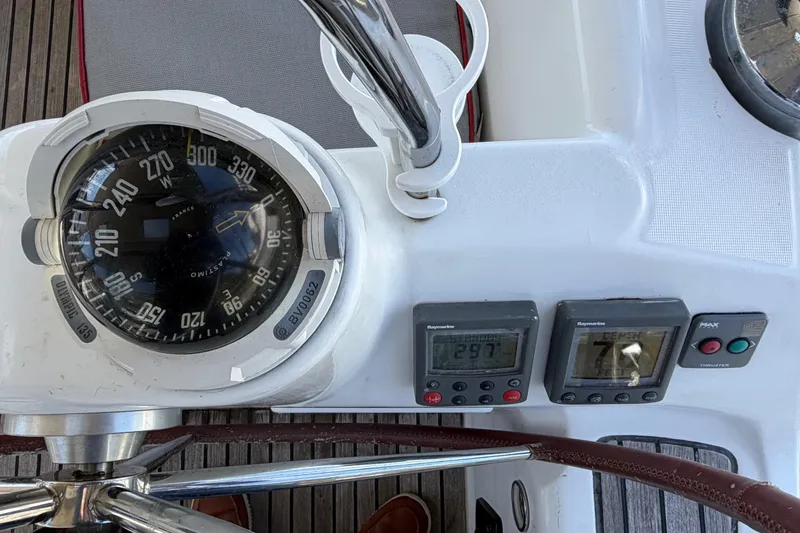 Slide: The Image of Cockpit instruments of a 2008 Beneteau 43 sailboat, featuring compass and navigation displays. - 25