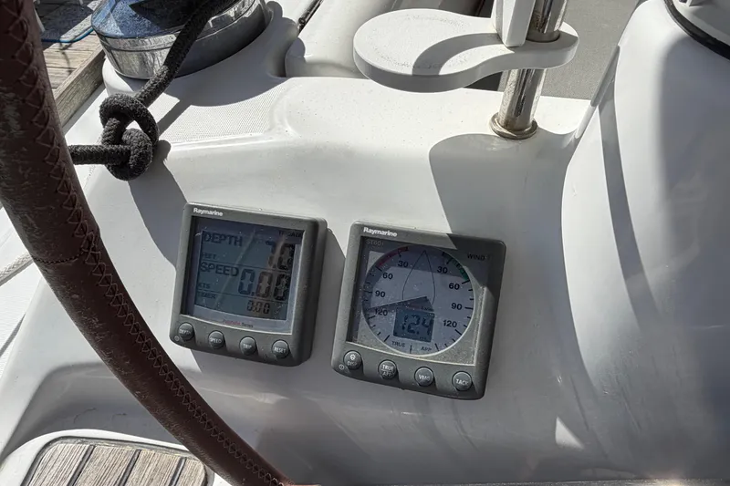 Slide: The Image of Cockpit instruments on a 2008 Beneteau 43 sailboat, displaying depth and wind speed. - 27