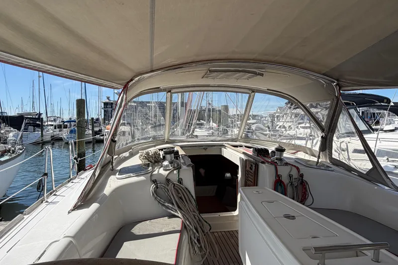 Slide: The Image of Cockpit view of a 2008 Beneteau 43 sailboat docked in a marina. - 32