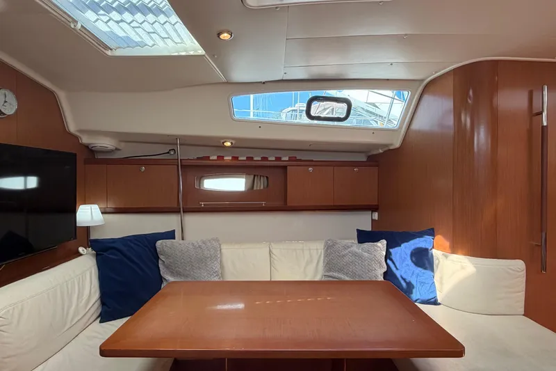 Slide: The Image of Interior of 2008 Beneteau 43 yacht with cozy seating and wooden finishes. - 37