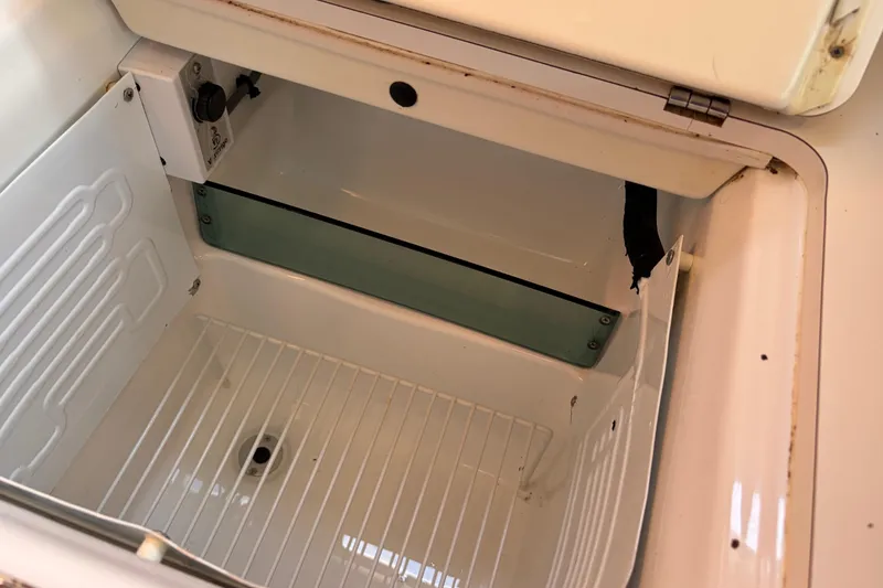 Slide: The Image of Empty refrigerator compartment in a 2008 Beneteau 43 yacht. - 44