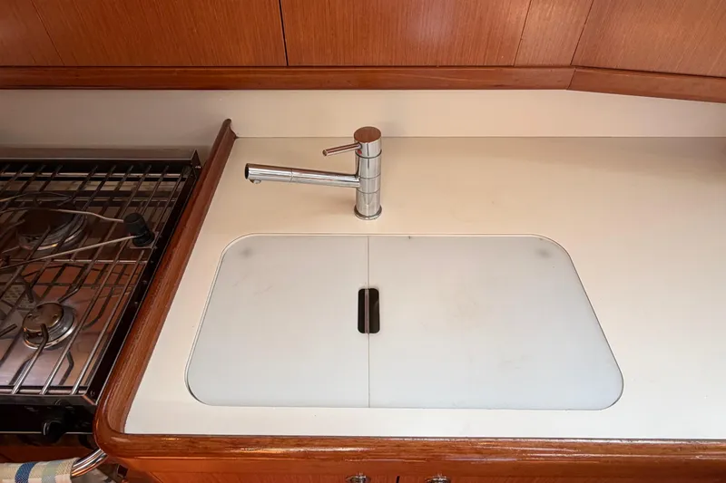 Slide: The Image of Galley sink and stove in 2008 Beneteau 43 yacht kitchen. - 48