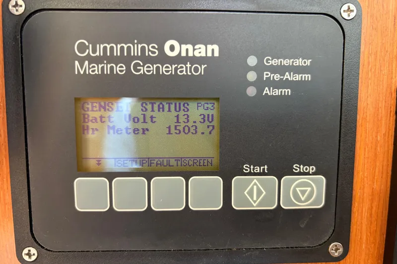 Slide: The Image of Cummins Onan marine generator display on 2008 Beneteau 43, showing battery voltage and hour meter. - 55