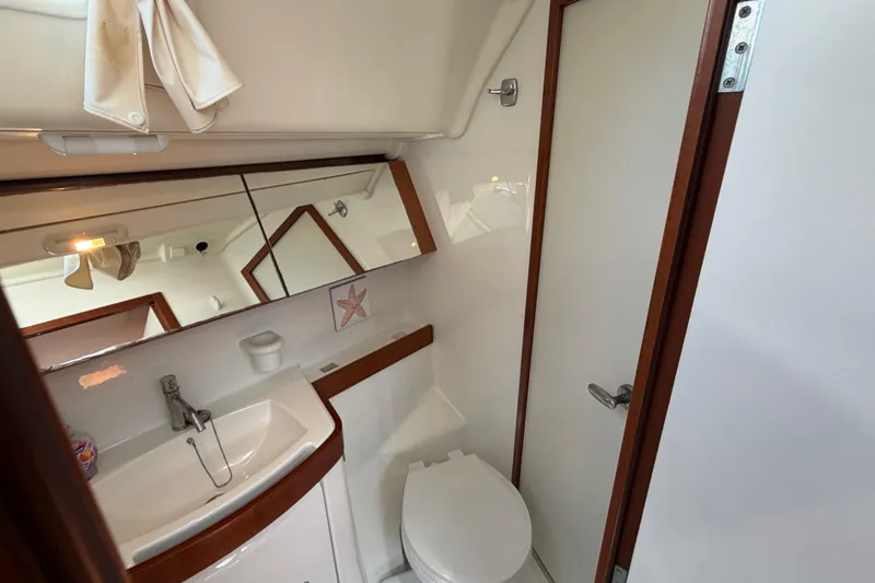 Slide: The Image of Bathroom interior of a 2008 Beneteau 43 yacht, featuring sink and toilet. - 57