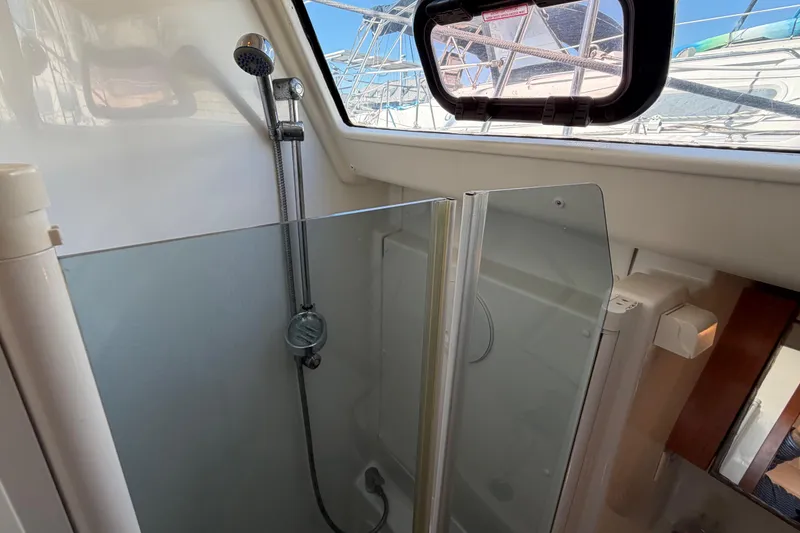 Slide: The Image of Interior shower area of a 2008 Beneteau 43 yacht with glass partition. - 58