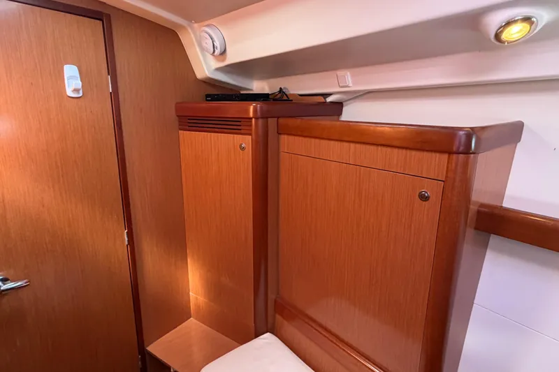 Slide: The Image of Interior of 2008 Beneteau 43 yacht with wooden cabinetry and ambient lighting. - 63