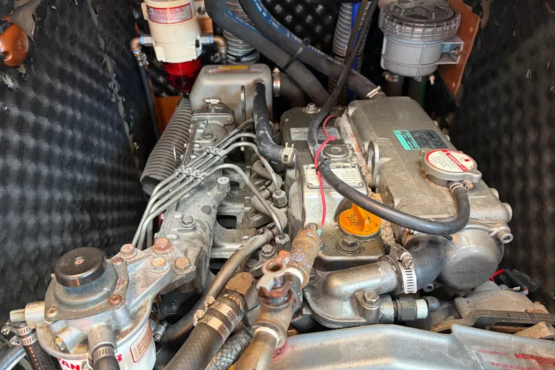 Slide: The Image of Engine compartment of a 2008 Beneteau 43 sailboat, showcasing mechanical components and wiring. - 67