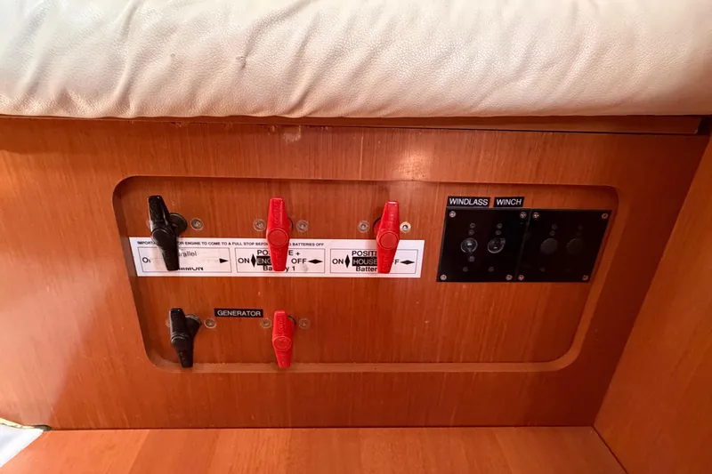 Slide: The Image of Control panel of a 2008 Beneteau 43 yacht with switches and labels. - 68