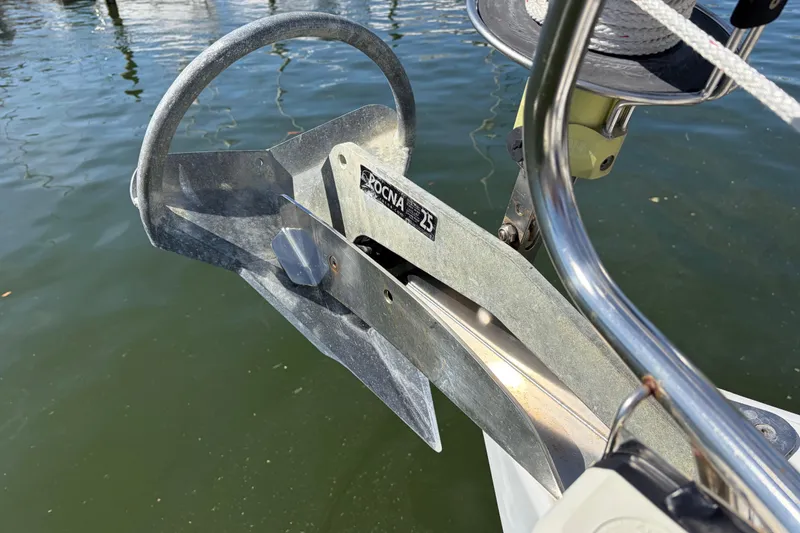 Slide: The Image of Anchor on a 2008 Beneteau 43 sailboat, positioned over calm water. - 7