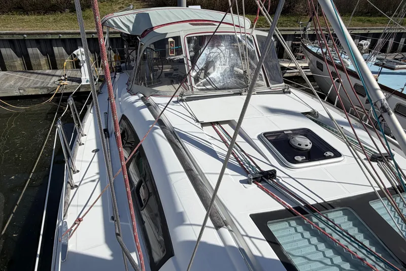 Slide: The Image of 2008 Beneteau 43 sailboat docked, showcasing deck and rigging details. - 9