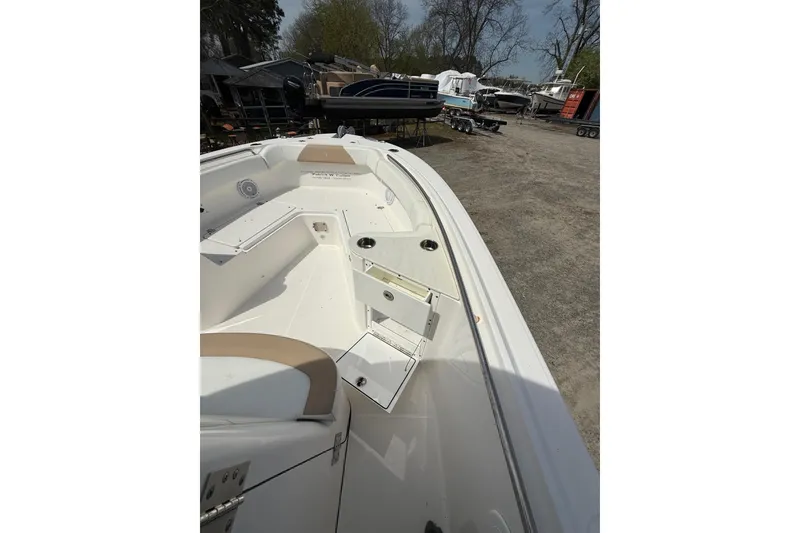 Slide: The Image of 2019 Edgewater 262CC boat interior with seating and storage compartments. - 36