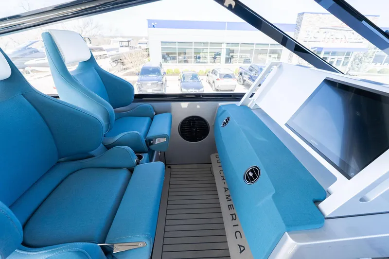 Slide: The Image of Interior of 2026 Dutch American DA 53 with blue seating and modern dashboard. - 12
