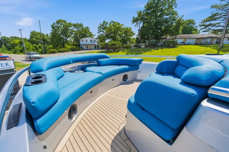 Slide: The Image of Luxurious blue seating on 2026 Dutch American DA 53 boat deck, surrounded by greenery. - 54
