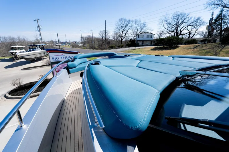 Slide: The Image of Luxury Dutch American DA 53 boat, 2026 model, with sleek blue upholstery and modern design. - 13