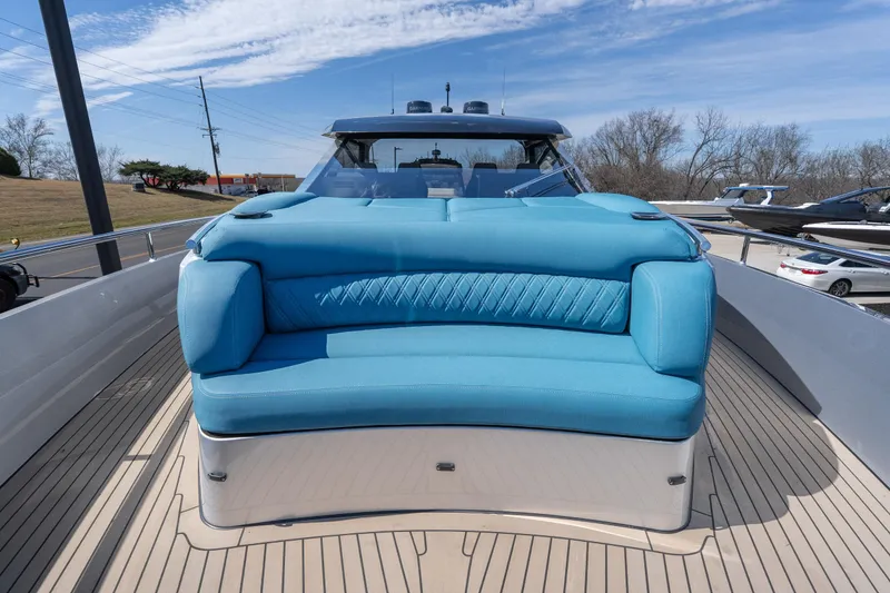 Slide: The Image of Luxurious 2026 Dutch American DA 53 yacht with blue seating on deck. - 15