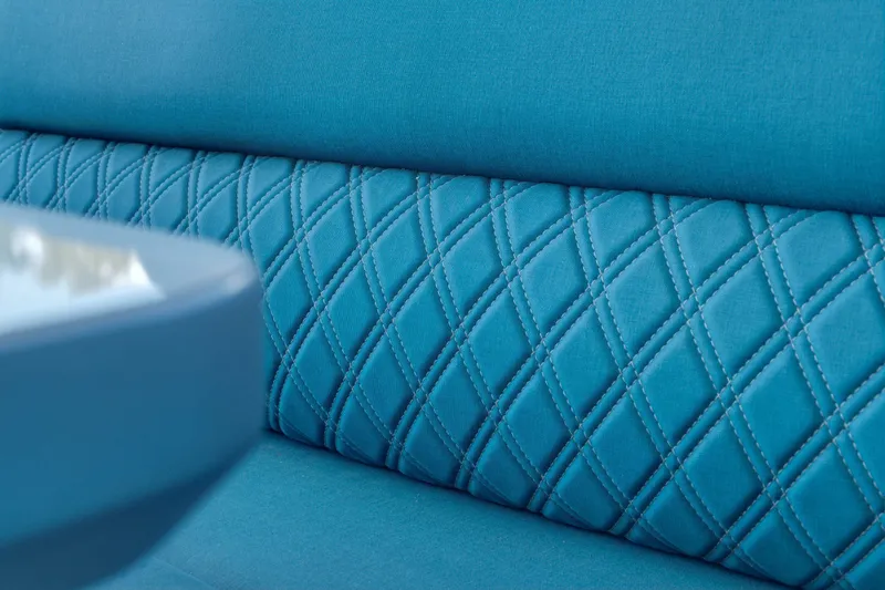 Slide: The Image of Quilted blue upholstery detail in Dutch American DA 53, 2026 model. - 29